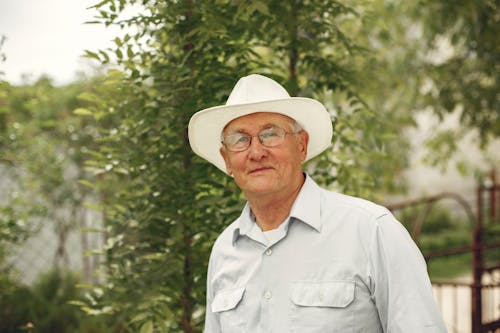 Free Man In Button Up Shirt Wearing White Hat Stock Photo