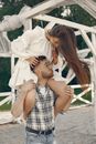 Young Woman Sitting on Man Shoulders