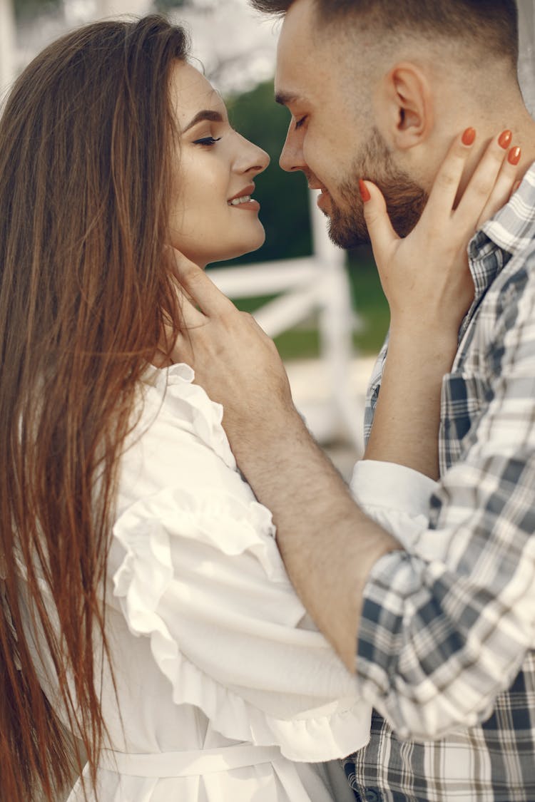 Couple Leaning In For Kiss