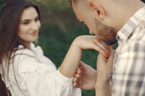 Free Photo of a Man Kissing a Woman's Hand Stock Photo