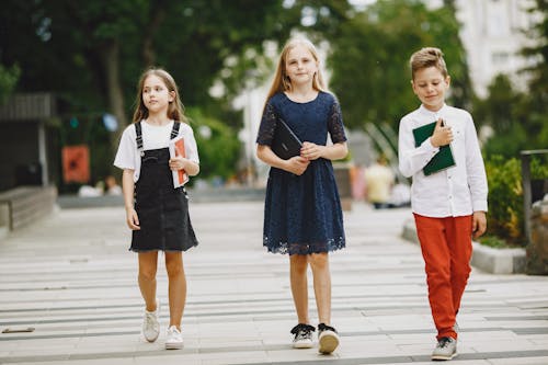 Free Photo of Kids Walking with Their Books Stock Photo