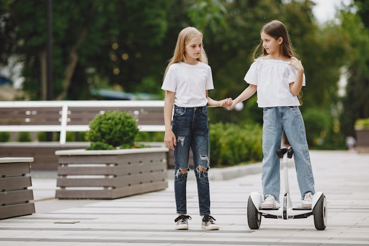 Girl On Hoverboard With Friend