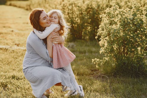 A Mother and Daughter Hugging Each Other