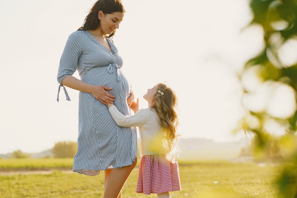 Pregnant Mother with Daughter · Free Stock Photo