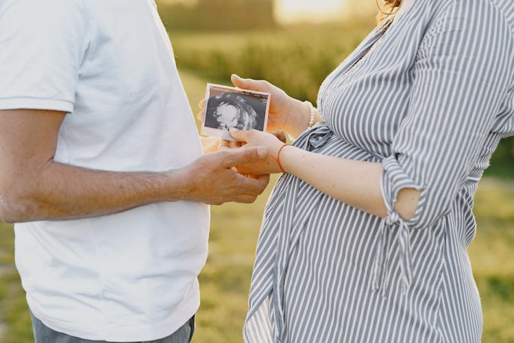 Couple Holding Ultrasound Photo