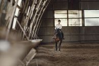 Man in White Shirt Riding Horse