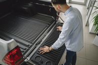 Man Holding the Tailgate of a Pick Up
