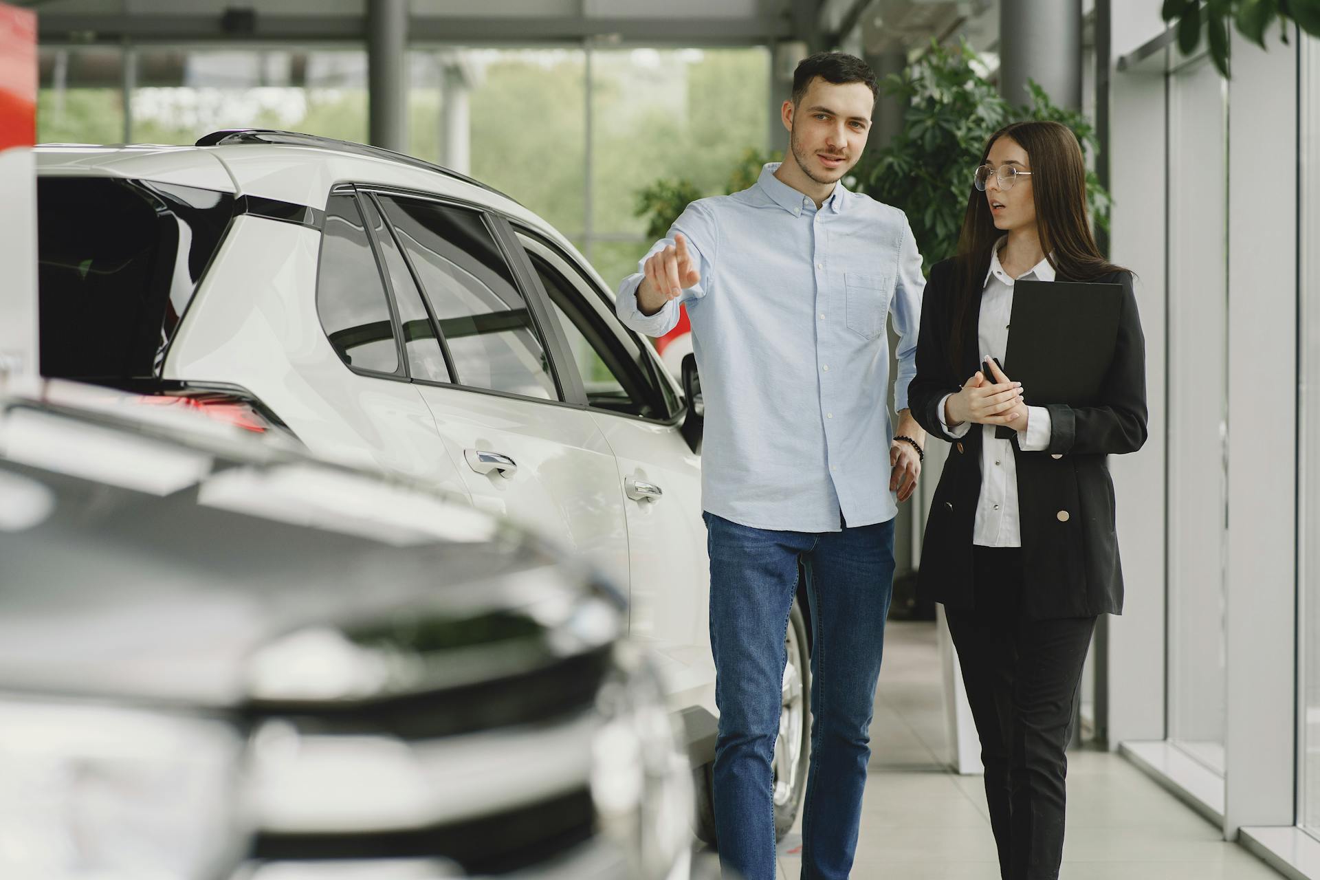 Dealership Employee Selling Car to Client