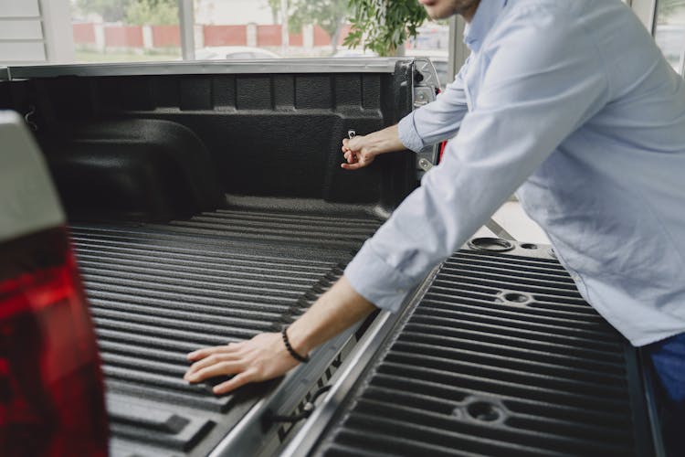 Man Opening An Empty Car Trunk