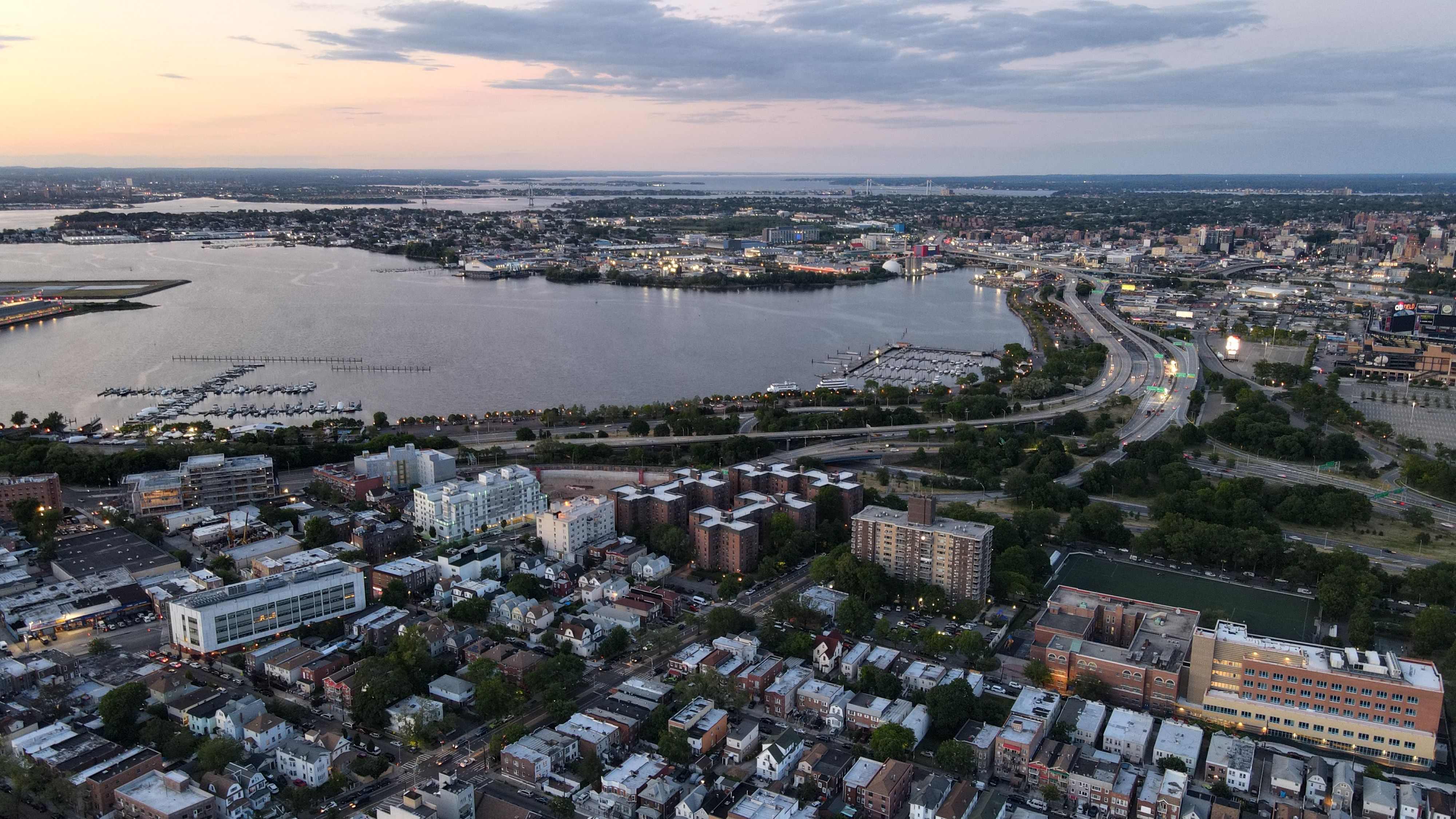 Aerial view of downtown Norfolk, VA skyline and Elizabeth River at sunset.