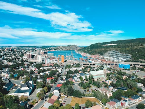 Aerial scenery of modern coastal city on summer day