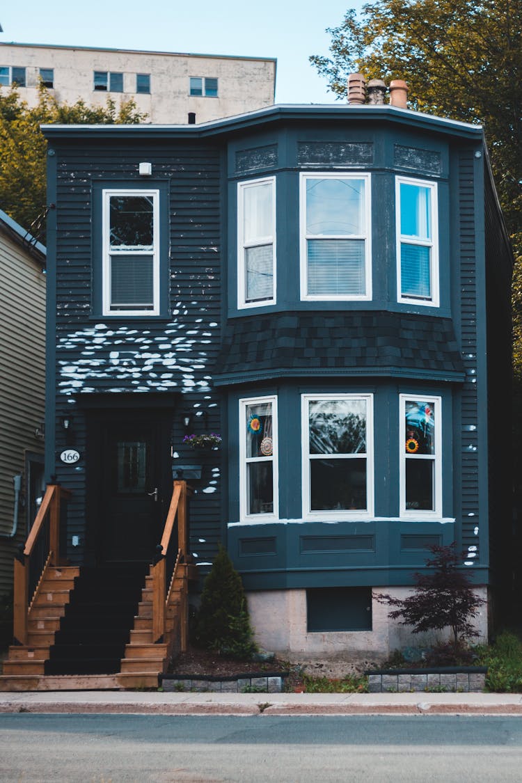 House With Wooden Stairs On Street