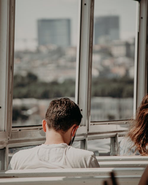 Gratis stockfoto met achteraanzicht, glasvenster, iemand