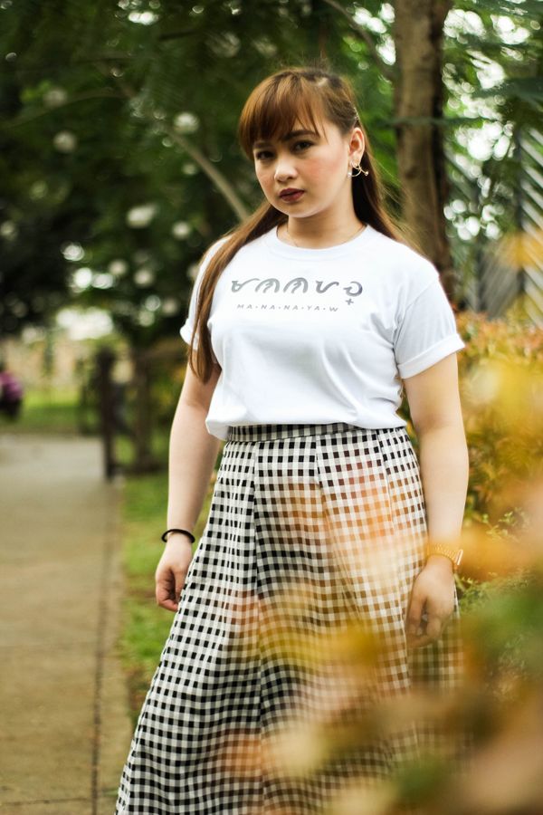 Woman wearing a printed A-line skirt with a white t-shirt