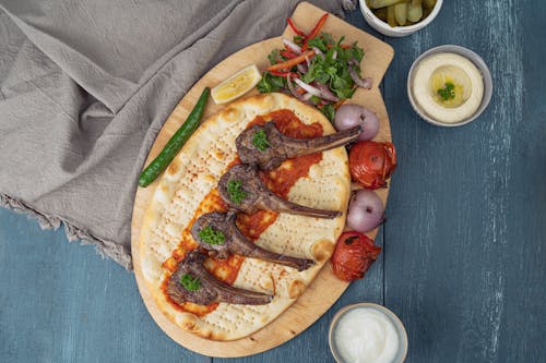 Top View of a Baked Dish with Bread, Meat and Vegetables