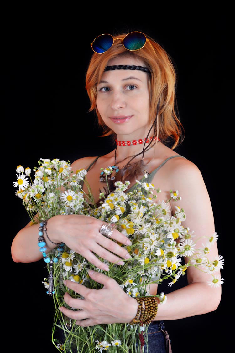 Millennial Hippie Woman Standing With Chamomile Bouquet On Black Background