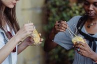 Person Holding Bread With Cheese
