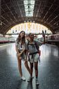 2 Women Standing on Bridge