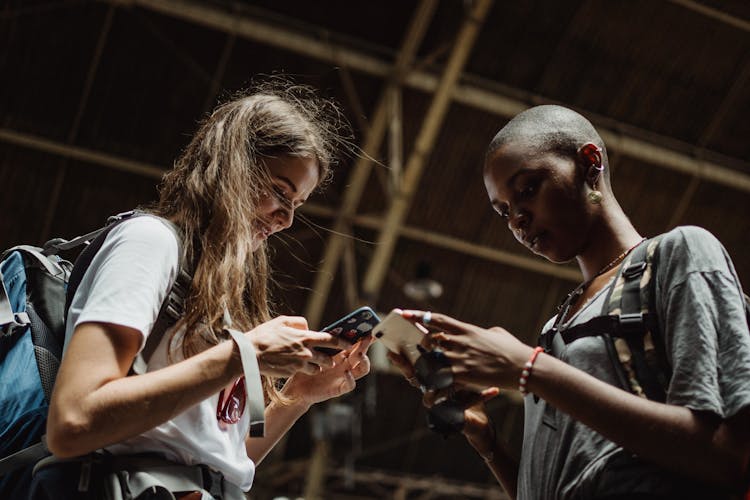 Two Women Busy Texting