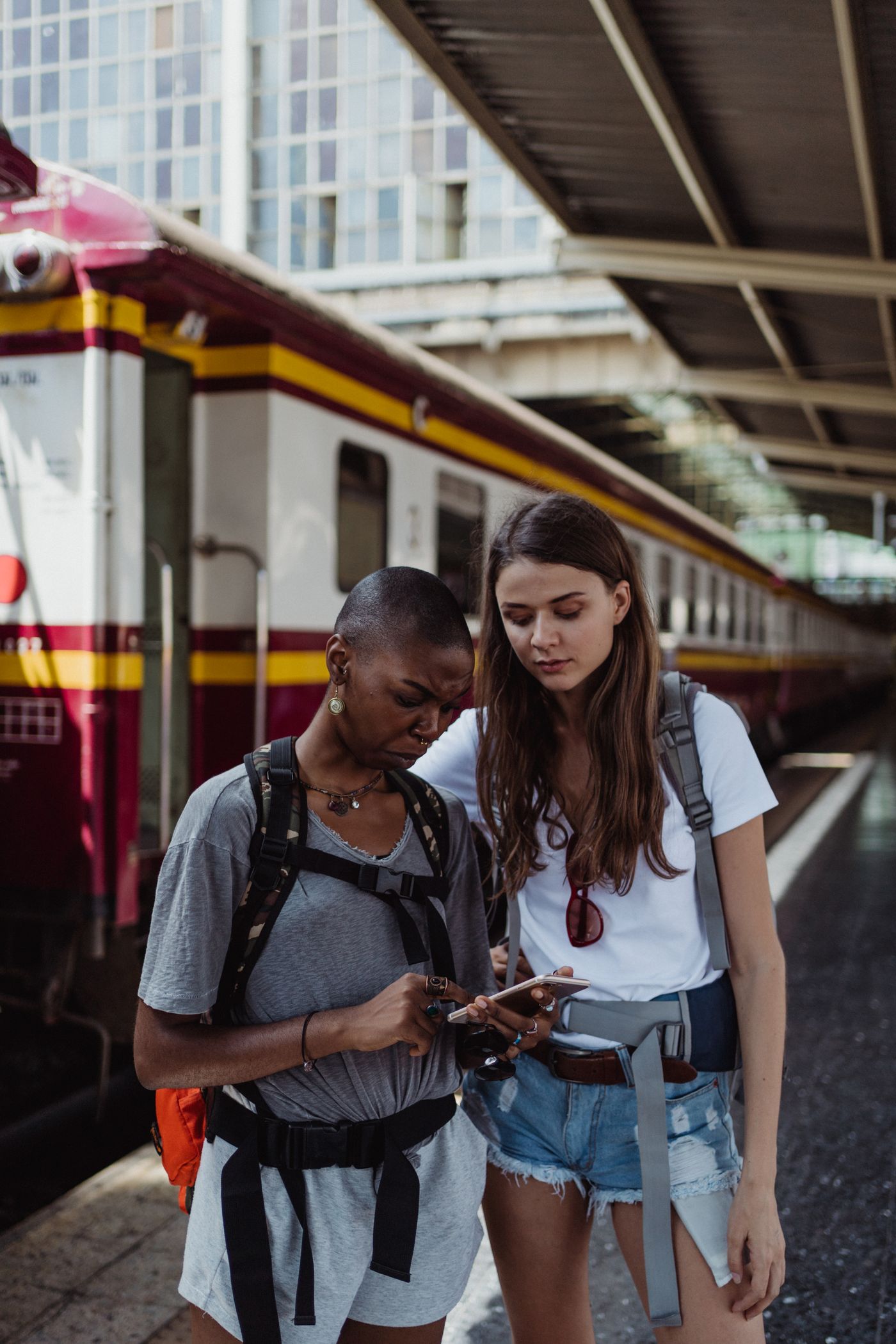 Travelers looking at a phone together