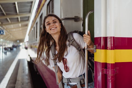 Woman Looking Out Train Car Doors