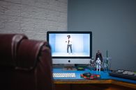 Silver Imac on Brown Wooden Table