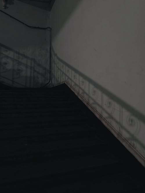 Grayscale Photo of a Concrete Staircase
