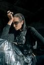 Woman in Black Leather Jacket and Black and White Skirt