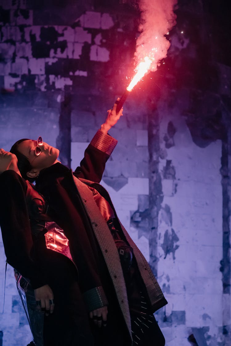 Man In Black Jacket Holding Red Fire Extinguisher