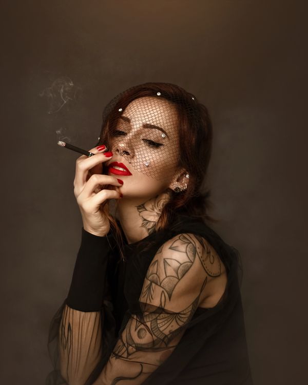 Stylish woman with red lips smoking cigarette · Free Stock Photo