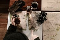 Black and Silver Camera Beside White Ceramic Mug