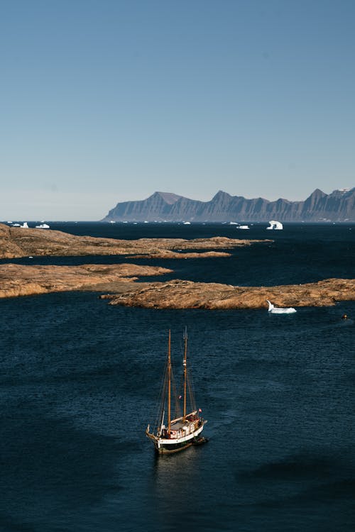 White and Brown Boat on Sea