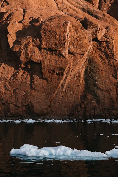 Brown Rock Formation on Water