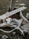 Brown Wooden Signage on Gray Rock