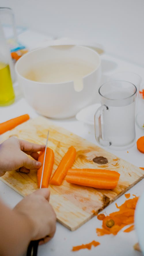 Free Person Chopping Carrot Stock Photo