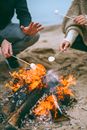 Person Holding a Stick With Fire