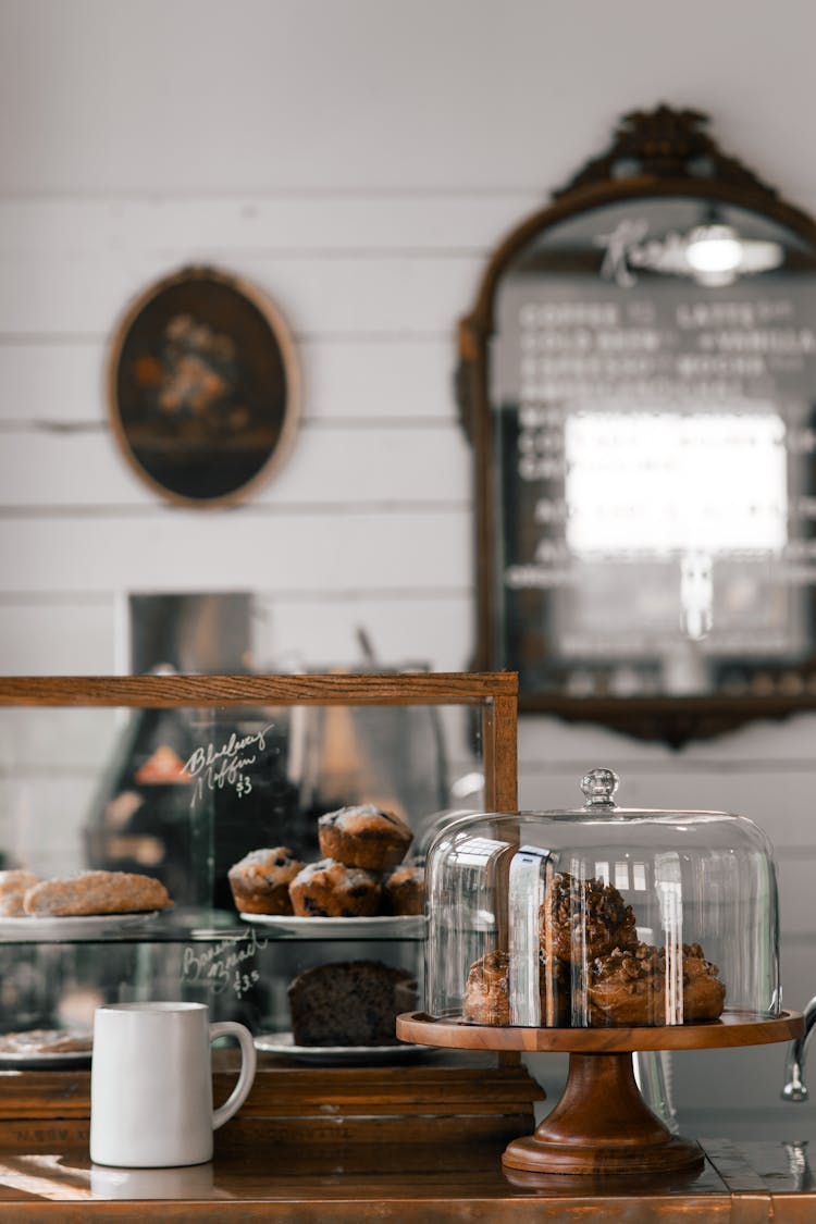 Delicious Pastries Near Mug In Local Bakery