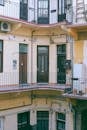 Exterior of residential apartment house with classic facade and common balconies in town