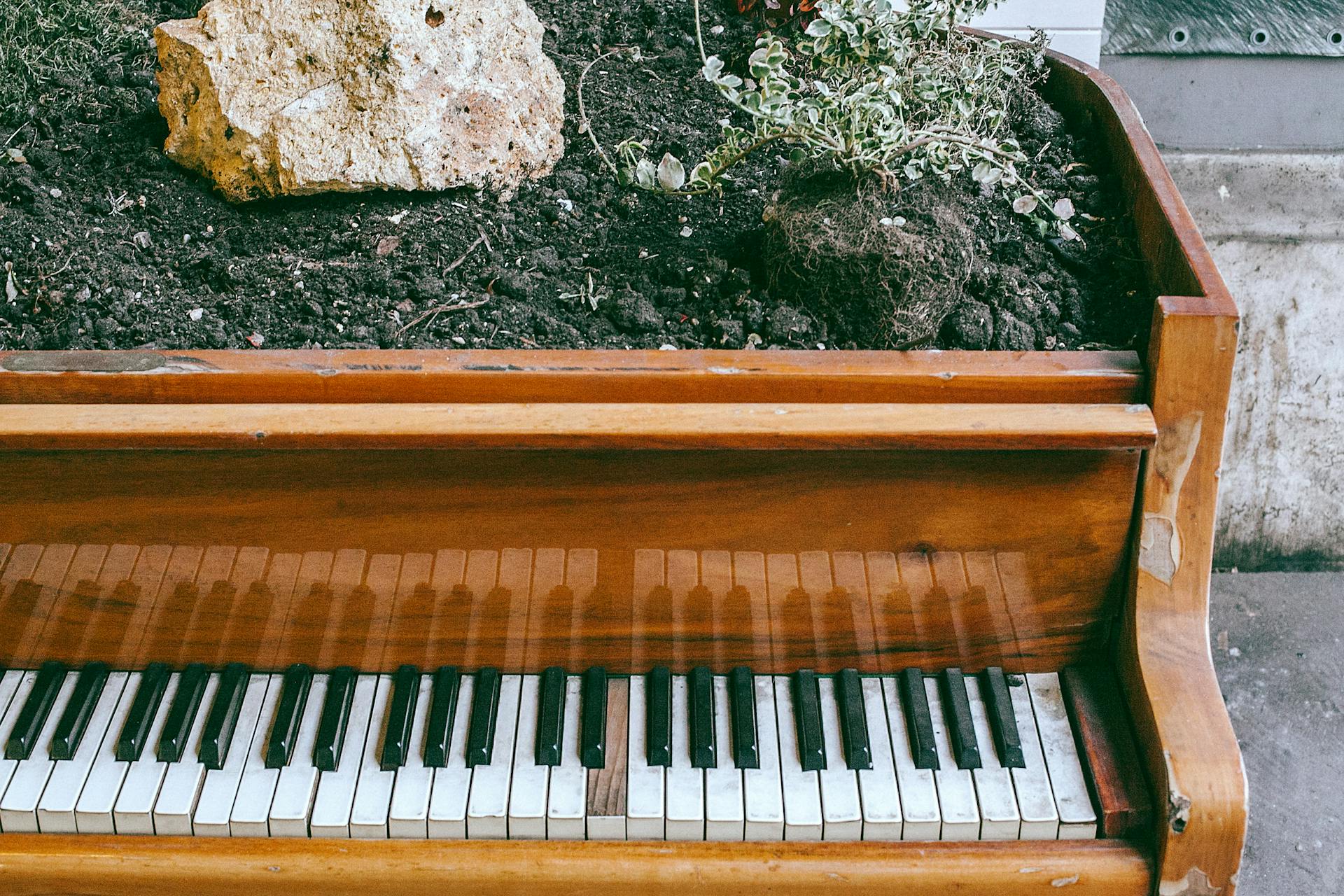 Old wooden piano on city street