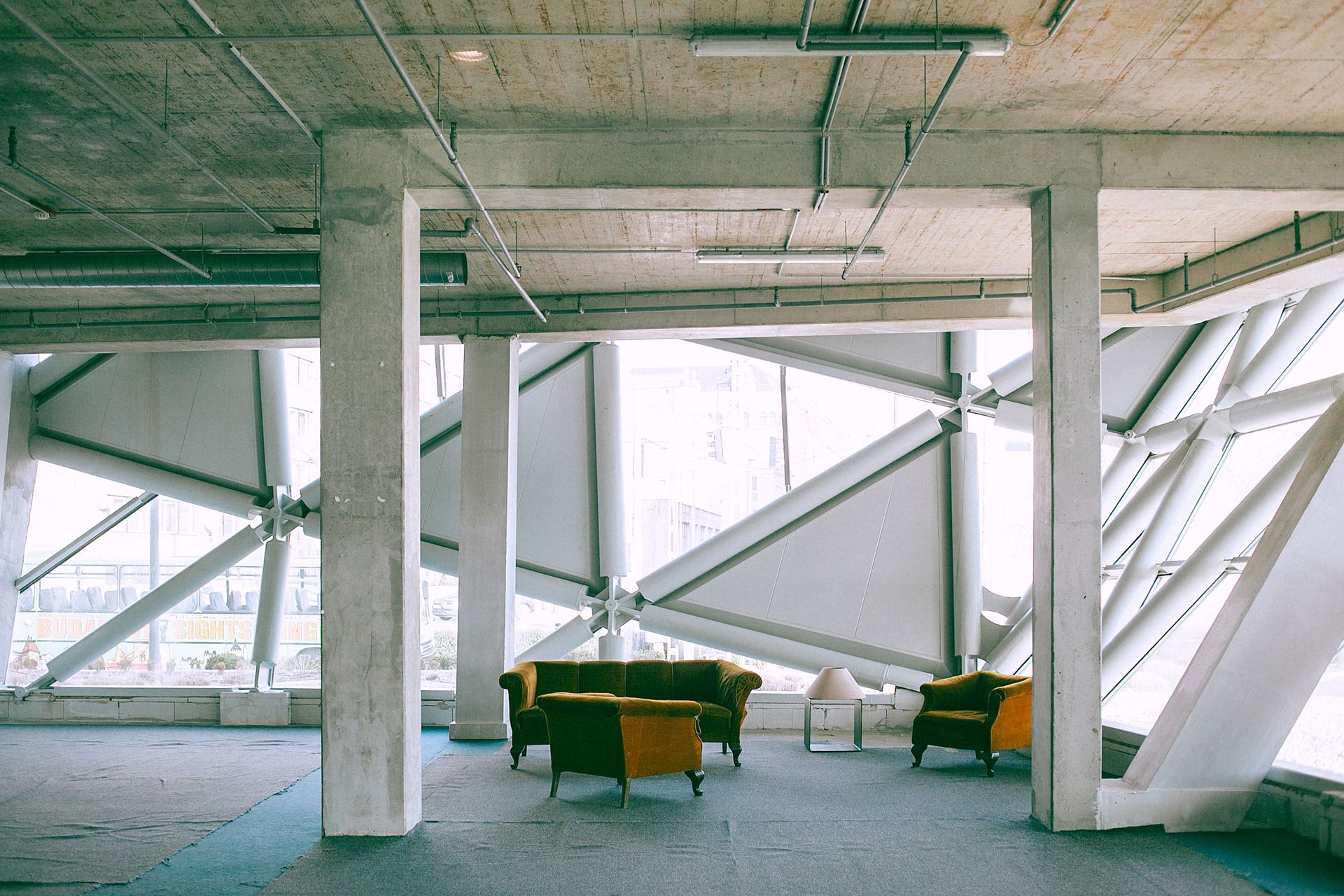 Loft interior in modern building with sofas