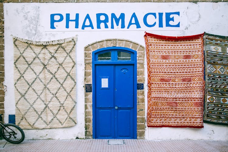 Exterior Of Shabby Pharmacy Building In Mediterranean Country