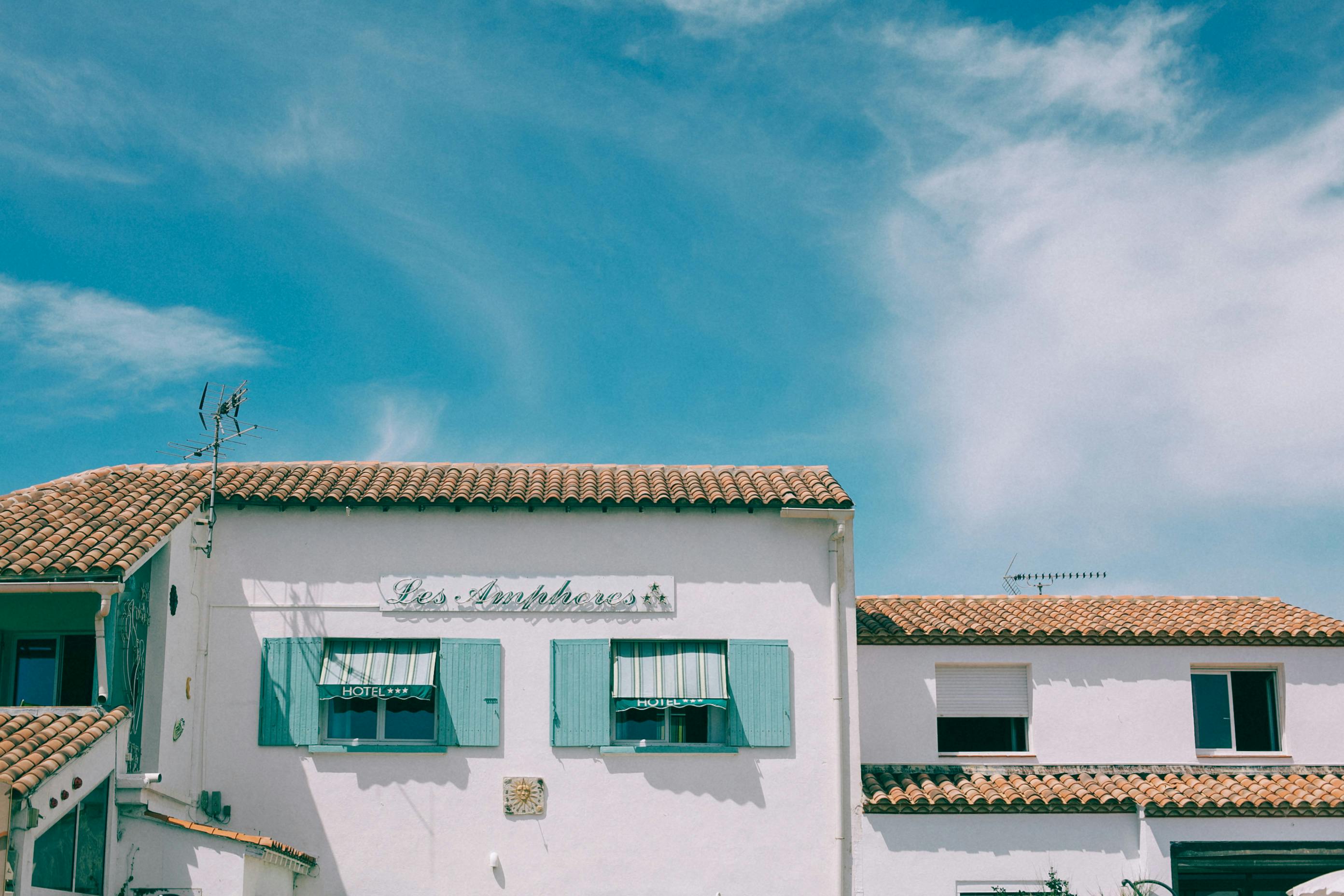 old residential house under blue sky