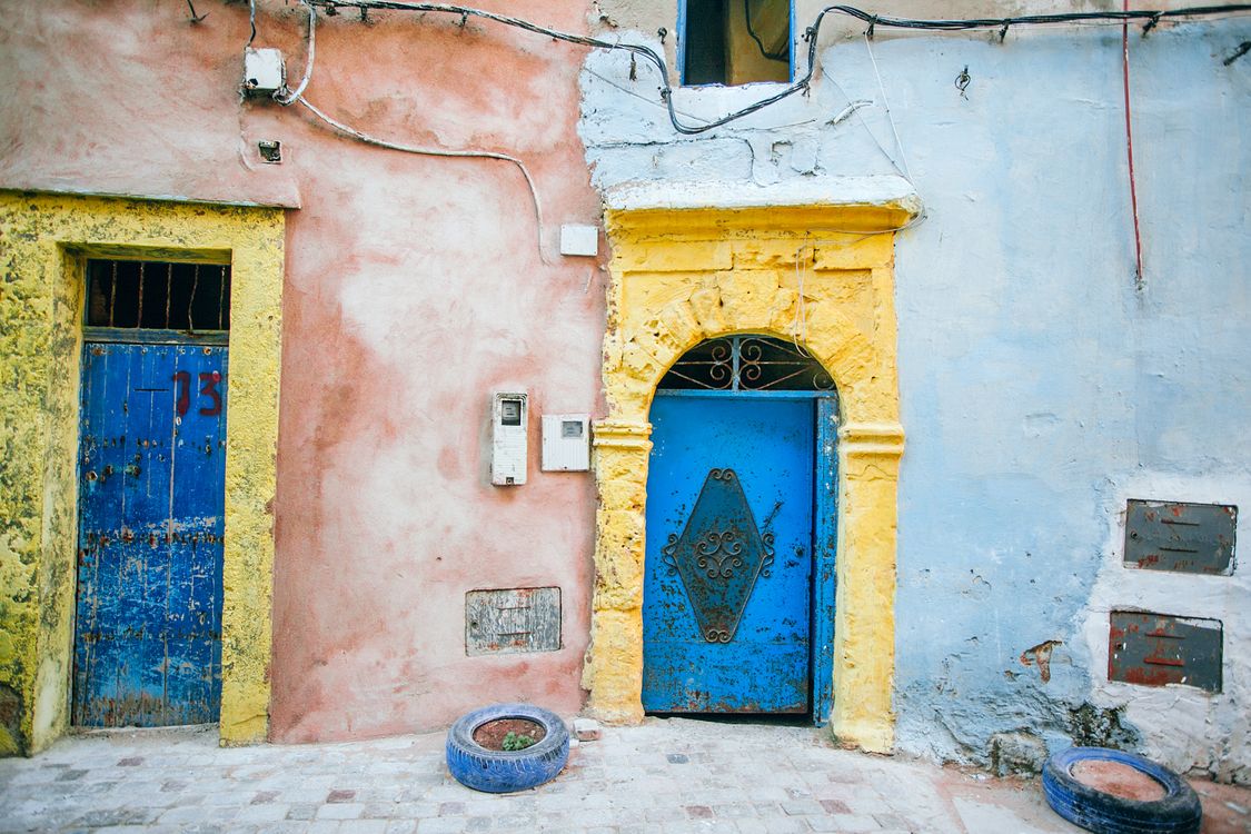 Threadbare Town Old shabby building with metal door · Free Stock Photo