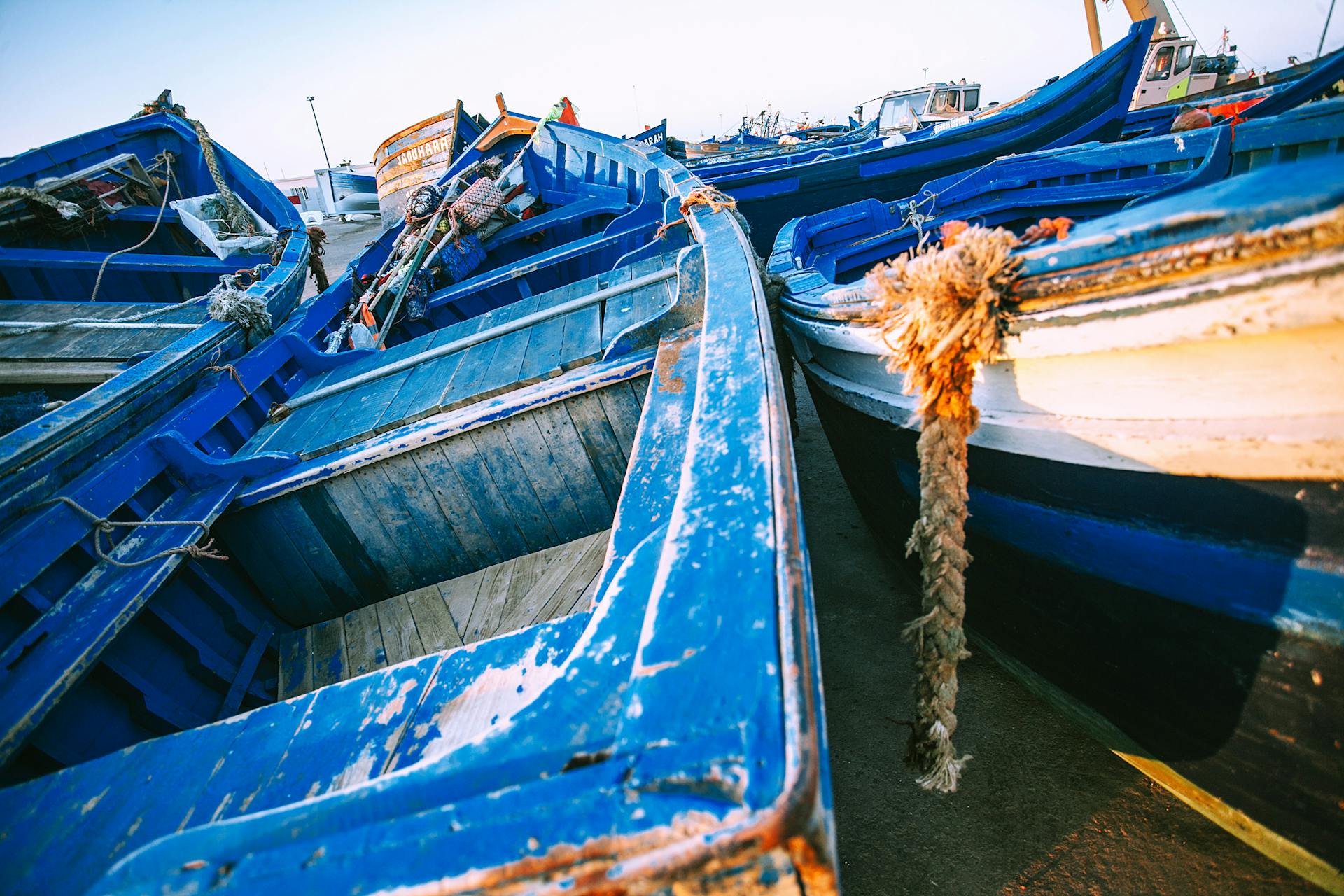 Shabby boats on coast of sea