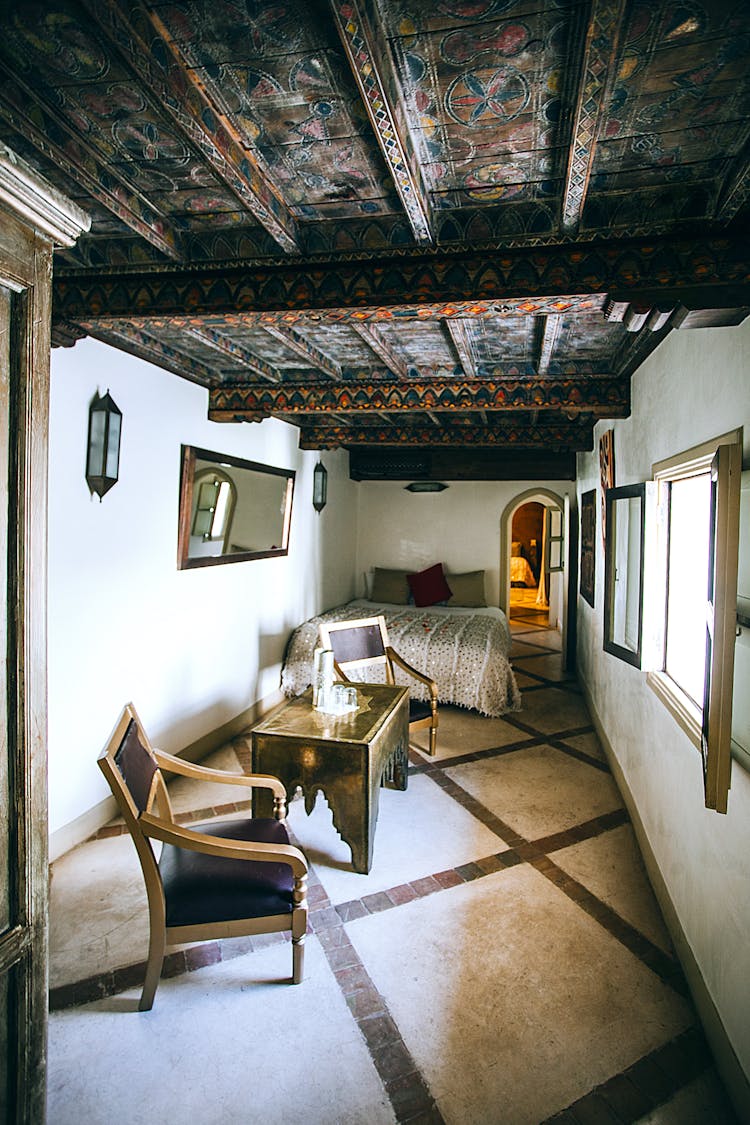 Interior Of Cozy Bedroom With Wooden Ceiling