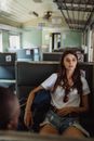 Woman Sitting on a Train