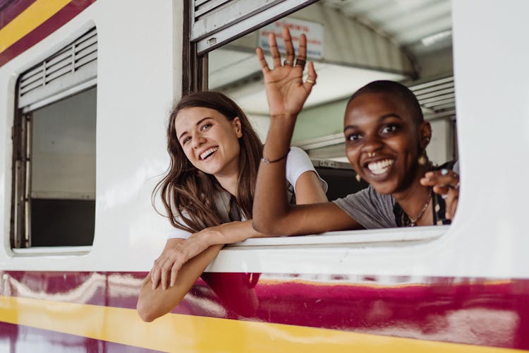 Women Waving From Train Window