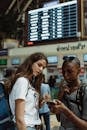 Man in White Crew Neck T-shirt Beside Woman in Blue Denim Jacket