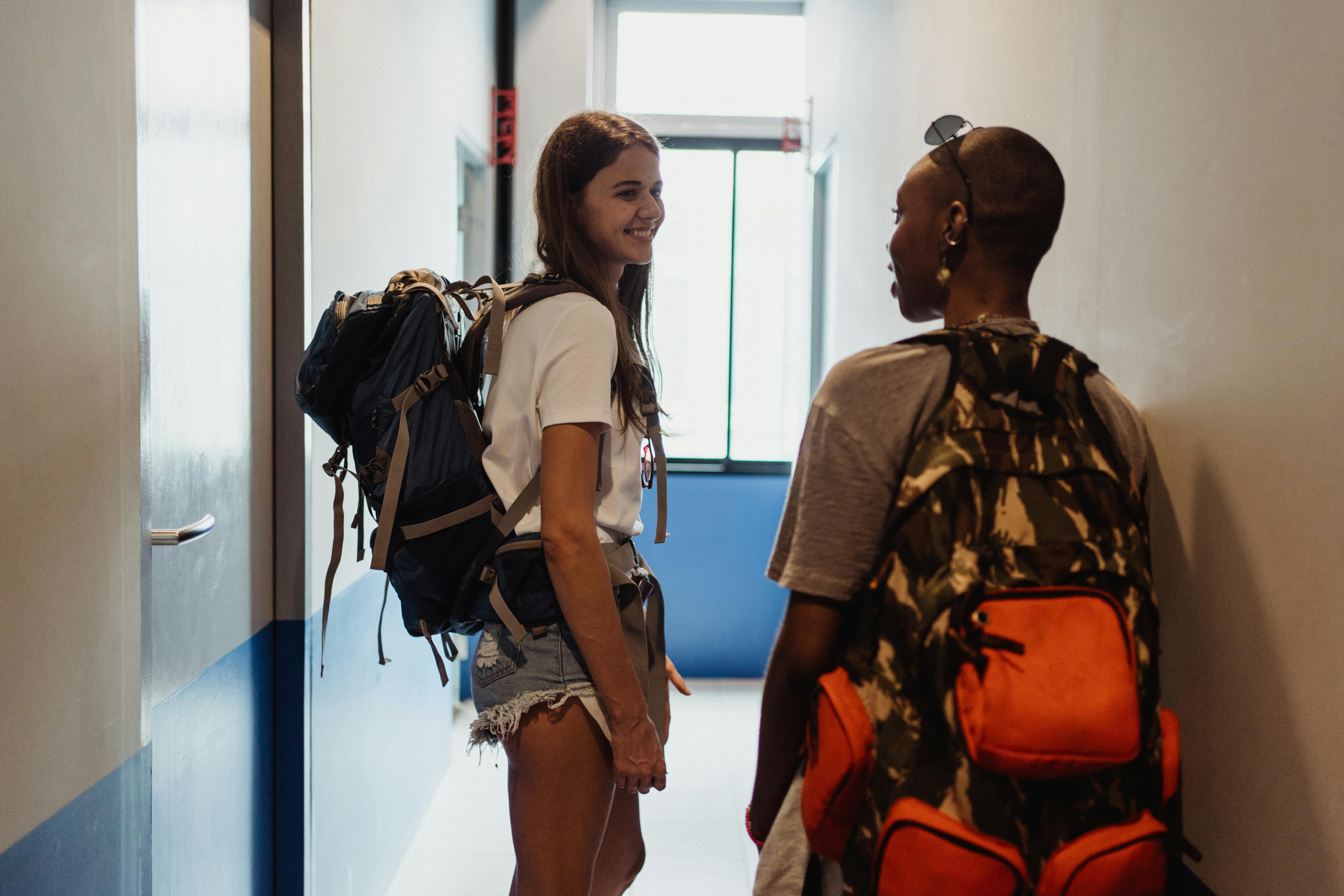 women looking for a room on a corridor