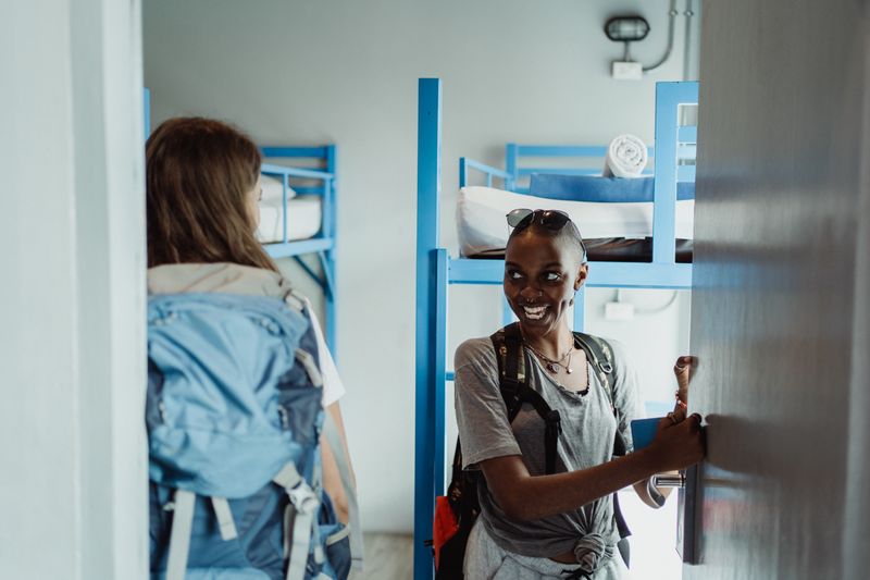 Backpackers in hostel dorm room
